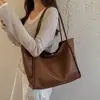 Bolsa de Ombro Única Grande Capacidade Retrô Casual Feminina Nova Moda 2026 Bolsa Tote com Textura Trançada Bolsa de Mão para Trabalho e Dia a Dia