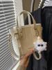 Bolso pequeño popular de este año para mujer 2025 primavera nueva moda bolso bandolera de hombro tendencia de textura bolso de cubo portátil