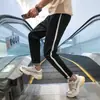 Calças Casuais Esportivas Masculinas Primavera e Outono Calças Coreanas Masculinas Soltas Estudante Casal Tendência Harlan Calças de Tornozelo