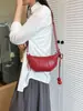 Bolso de axila de moda y chic estilo francés, bolso de cuerno elegante y único, nuevo modelo 2026, alto valor estético, bolso de mano simple y casual para mujer