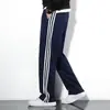 Pantalones de Uniforme Escolar de Comercio Exterior Primavera Pantalones Deportivos de Tres Rayas Hombres Primavera y Otoño Sueltos de Pierna Recta Modernos Versátiles Pantalones de Chándal Pantalones Casuales Hombres