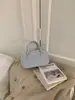 Bolsa de Moda de Luxo para Mulheres 2026 Nova Tendência Simples Bolsa de Mão Bolsa de Ombro Versátil Transversal Pequena Quadrada para o Dia a Dia