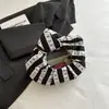 Bolso de mano rayado único para mujer, nuevo bolso de mano de moda casual elegante para el otoño de 2026, para ir al trabajo y salir
