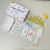 Conjunto de acessórios para bolo Fábrica Ningjin conjunto de sete peças em caixa velas de aniversário chapéu de coroa faca garfo prato de plástico descartável