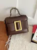 Bolso de mano texturizado transfronterizo 2026 nuevo de verano para mujer bolso vintage de alta gama bandolera con decoración de cinturón bolso cruzado