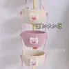 Cesta colgante de tres capas del fabricante Cesta de cuerda de algodón para Año Nuevo Decoración Cesta de almacenamiento de cosméticos de tres Ouli de dibujos animados Cesta para el hogar montada en la pared