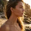 Nuevo collar de acero inoxidable de estilo europeo y americano transfronterizo que no se decolora, con modernos colgantes de corazón, hoja, cruz y cuentas
