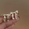 Pendientes de Lujo Ligero Estilo Coreano Elegantes con Pliegues y Lazo Personalidad Transfronterizos Populares Modernos Diseño de Nicho Pendientes