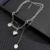 Collar de acero de titanio doble Love para mujer, estilo hip-hop, cadena de clavícula que combina con todo, accesorios colgantes con cara sonriente de alta gama.