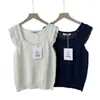 Lino + Algodón Guangzhou Shisanxing Imis* En Stock Verano 2026 Chaleco de Punto con Encaje Patchwork Cuello en U Mangas Acampanadas para Mujer