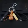 Doce Signos del Zodiaco Calabaza de Madera de Durazno con Llavero de Barra de Oro Hebilla de Cinturón de Cuero Colgante de la Suerte Zodiacal Regalo de Negocios