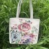 Bolso de lona lavable de gran capacidad con bordado de seda dorada de doble cara de camelia blanca y negra