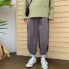 Calça reta estilo escuro Yamamoto transfronteiriça para homens, calça pantalona com design de cordão na barra, calça casual cropped de nicho