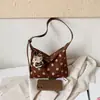 Bolso de gran capacidad para mujer, nuevo y popular bolso de hombro y axila de lunares 2026, bolso de mano pequeño elegante y único