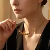Cadena para clavícula dorada de doble capa, simple y elegante, collar de acero de titanio con borla en forma de corazón, moda vintage de lujo ligero para mujer