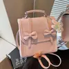 Mochila de mujer estilo coreano estilo universitario transfronteriza, bolsa de gran capacidad para el día a día, nueva mochila ligera de viaje con lazo