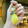 Accesorios creativos transfronterizos de mango y limón, llaveros de coche modernos y populares, colgantes de bolsa de frutas de alto valor