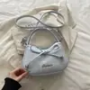 Moda Estrela do Comércio Exterior bolsa feminina 2026 nova laço moderna estilo coreano chique bolsa de ombro transversal para mulheres