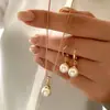Collar con Colgante de Perla Artificial de Nuevo Estilo Transfronterizo Europeo y Americano con Diseño Elegante, Juego de Aretes y Collar de Perlas de Lujo Ligero al por Mayor