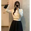 Top elegante de cuello redondo estilo coreano para primavera y otoño con mangas abullonadas y entallado en la cintura, suéter de punto liso hueco de invierno para mujer