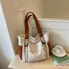 Nova bolsa feminina de lona lisa 2026, bolsa de ombro de grande capacidade, bolsa tote estilosa para estudantes, bolsa de mão e bolsa transversal