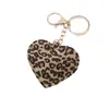 Chaveiro de Couro Sintético com Estampa de Leopardo e Coração para Casal Europeu e Americano Novo, Pingente de Coração de Pêssego para Carro, Pingente para Bolsa, Acessórios, Venda por Atacado