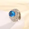 Europa e Estados Unidos transfronteiriços anel feminino cobre banhado a ouro simulação cristal azul temperamento anel em forma de ovo pedra principal 10*12