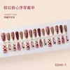 Unhas postiças em formato de coração vermelho-acastanhado, unhas trapezoidais longas com coração bordô e glitter floral, disponíveis para atacado