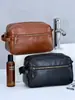 Cross-border High-end Sense Bolsa de higiene masculina Divisória de armazenamento Alto valor Grande capacidade PU Bolsa de cosméticos de viagem portátil