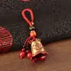 Llavero de campana de la fortuna de aceite rojo con diseño original con murciélago y símbolo de la fortuna, cuerda tejida a mano con colgante de campana de cobre para llaves del coche
