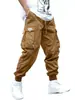 Pantalones holgados de moda para comercio exterior en sitio web independiente con diseño de bolsillo tridimensional, pantalones jogger para hombre, versátiles para deportes al aire libre, en stock para venta al por mayor