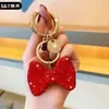 Nuevo Llavero de Arco de Diamante Flash Versión Coreana de Amazon, Colgante de Bolso de Moda de Alta Gama, Llavero de Coche