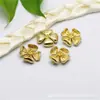 Accesorios de joyería DIY, nuevos accesorios de joyería de cobre puro, pendientes de botón de flor de cuatro hojas simples, accesorios de fábrica al por mayor