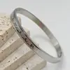Joyería Moderna al por Mayor: Pulseras de Acero Titanio para Pareja con Cierre Recto Simple, Pulseras de Broche, Pulseras de Corazón de Amor ECG