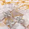 Redes sociales hueco ojo de gato mariposa aleación joyería para uñas dorado plateado metal decoración de uñas tridimensional fabricantes venta al por mayor
