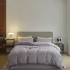 Juego de ropa de cama de cuatro piezas de color sólido de alta gama, liso, cerámico, ligeramente cepillado, algodón puro, funda de edredón de algodón de fibra larga, juego de tres piezas