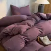 Novo conjunto de cama de quatro peças de algodão amigável à pele 2026, com sensação de nuvem, respirabilidade e cores sólidas, atacado para dormitórios estudantis