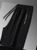Pantalones deportivos a cuadros de verano, pantalones casuales de moda, pantalones de cinco puntos de marca de moda, pantalones rectos nuevos y populares para hombres jóvenes