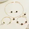 Set de joyería europeo y americano transfronterizo, collar con diseño de trébol de cuatro hojas geométrico con goteo de aceite, aretes y pulsera versátiles y elegantes