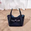 Bolso tote de cuero genuino nuevo 2026, diseño de nicho, bolso de mano de cuero mate, cierre estilo Kelly, bolso cruzado para el trabajo