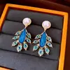 Pendientes de borla ovalados con incrustaciones de diamantes y pasador de plata vintage, lujo ligero, moda de alta gama, diseño simple y único, pendientes versátiles