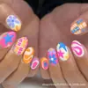 24 piezas de uña postiza para llevar transfronteriza, acabado nuevo, estilo dulce y fresco europeo y americano, patrón de graffiti de color, arte de uñas desmontable