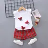 2026 Novo Estilo Conjunto de Verão para Meninas Desenho Animado Xadrez Manga Curta Conjunto de Duas Peças Tendência Roupa de Verão para Bebê