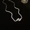 Collar con colgante de cadena de circonita iridiscente, cadena para suéter de lujo ligero de alta gama, cadena retro de nicho, joyería versátil al por mayor para mujer