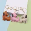 Llavero creativo de perro para coche con impresión a doble cara, colgante para mini bolso para hombres y mujeres, exquisito accesorio de llavero de cachorro