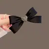 Horquilla con lazo de amor y diamantes de imitación negros para mujer, accesorio para el cabello con media horquilla y parte trasera de la cabeza, con clip de resorte