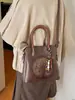 Bolso de Mano de Estilo Étnico Transfronterizo de Nicho Retro para Mujer 2026 Nuevo Bolso Cubo de Textura de Alta Calidad Bolso de Hombro Cruzado