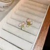 Nuevos aretes dulces de tulipán, superventas transfronterizos, aretes simples de estilo pastoral, aretes personalizados de perla cruzada para mujer, modernos