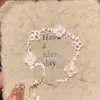 Pulseira Flor Sonho Rosa Trevo de Quatro Folhas, Pulseira Exquisita de Madrepérola de Alto Padrão, Pulseira de Luxo Leve Estilo Ajustável, Estilo Ins