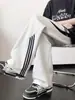 Pantalones de chándal de retazos a rayas para hombre, pantalones casuales holgados de peso pesado retro de otoño, pantalones deportivos juveniles de pierna recta ancha de moda